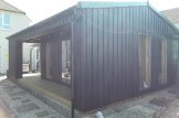 Abri de jardin en bois avec terrasse ANNA Modern (Isolé, 34 mm + bardage), 20 m² + 16 m² terrasse customer 3